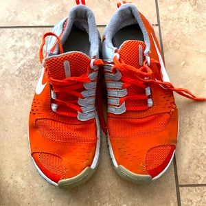 Orange Nike Free running shoe